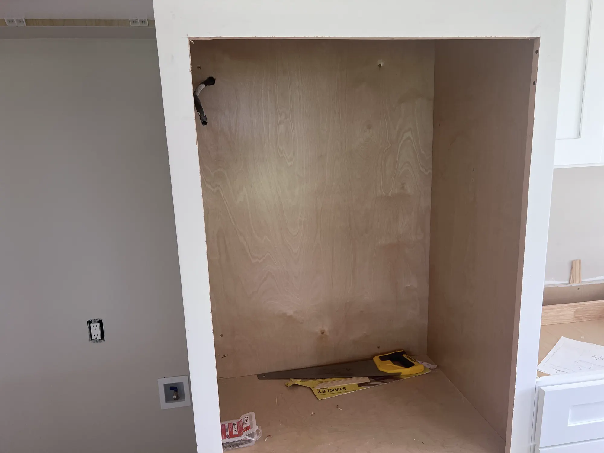 Open kitchen cabinets in the middle of the renovation