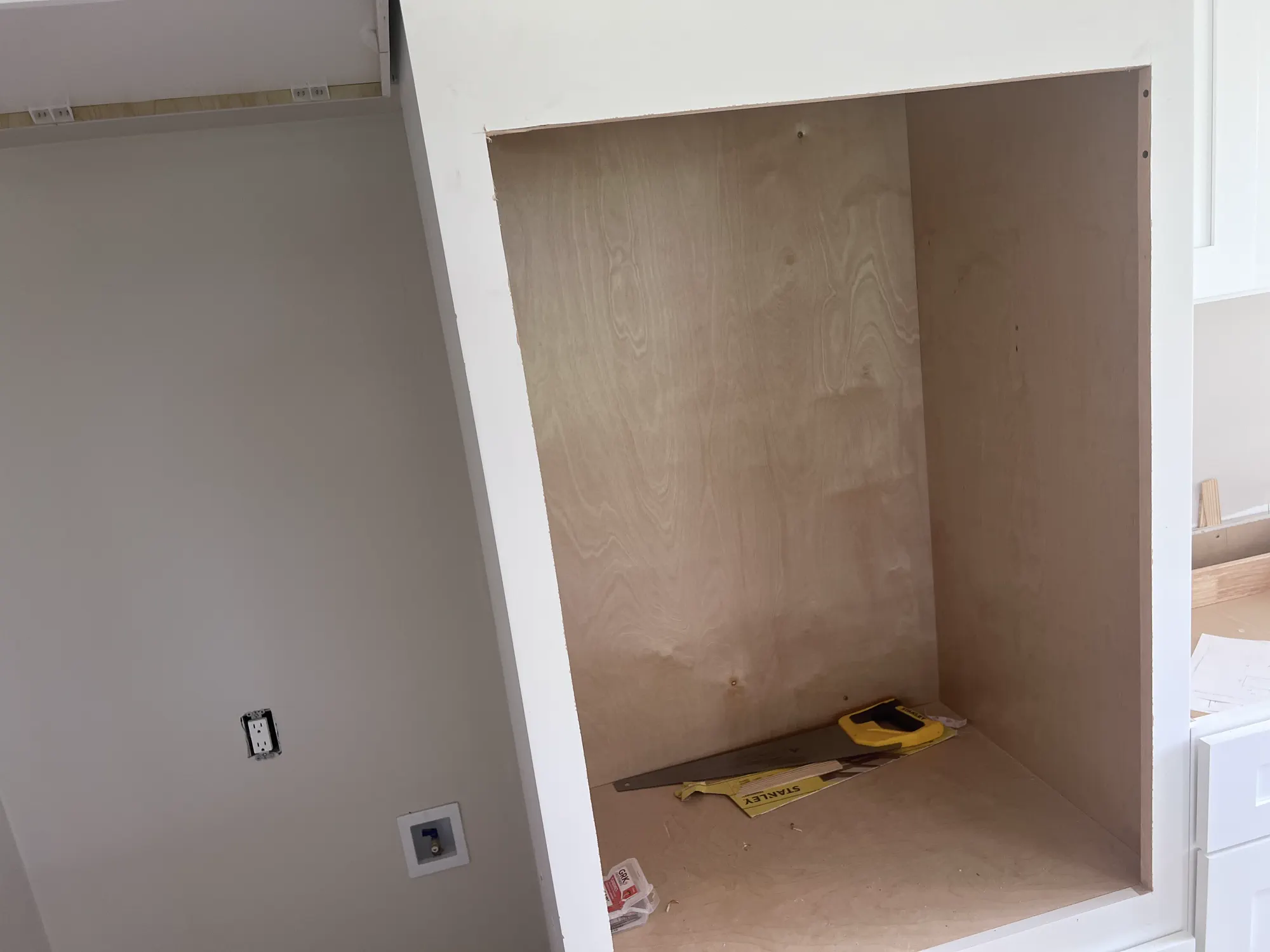 A renovation work area with materials and unfinished details